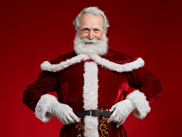 Santa Claus Posing against Red