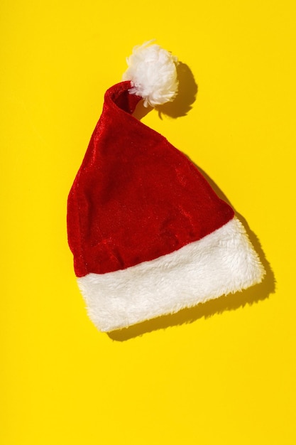 Santa Claus red hat isolated from above on colorful background