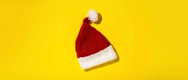 Santa Claus red hat isolated from above on colorful background