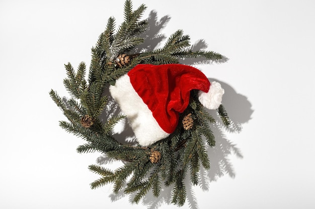 Santa Claus red hat isolated from above on colorful background