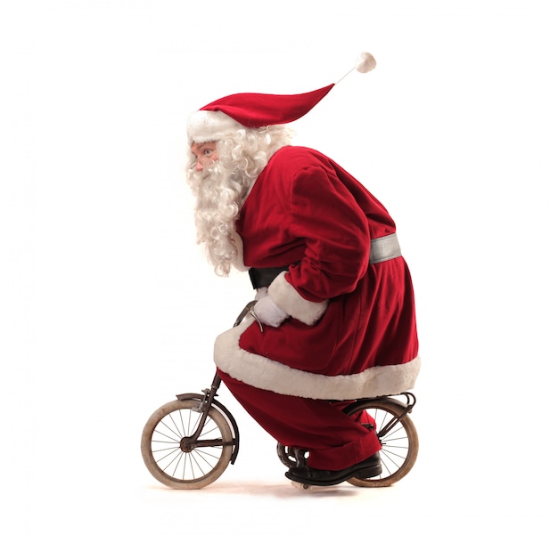 Santa Claus riding a tiny bike