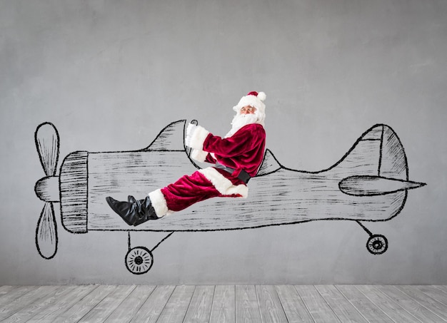 Photo santa claus senior man travel by air . christmas xmas holiday concept