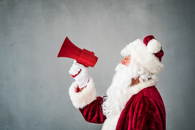 Santa Claus shouting into megaphone