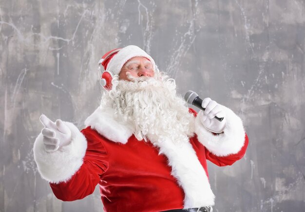 Santa Claus singing Christmas songs on grunge background