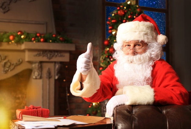 Santa Claus standing with thumbs up. Home decoration.