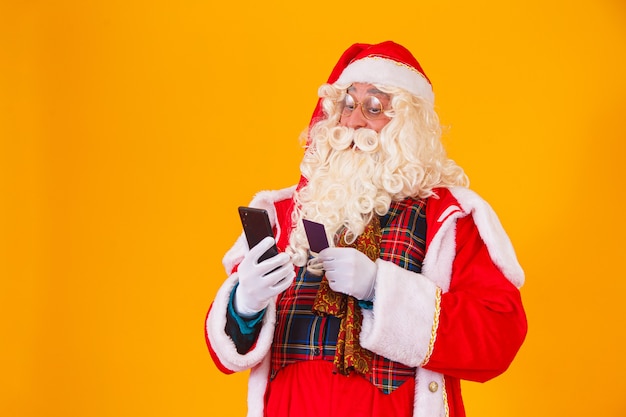 Santa Claus using credit card to pay for internet purchases