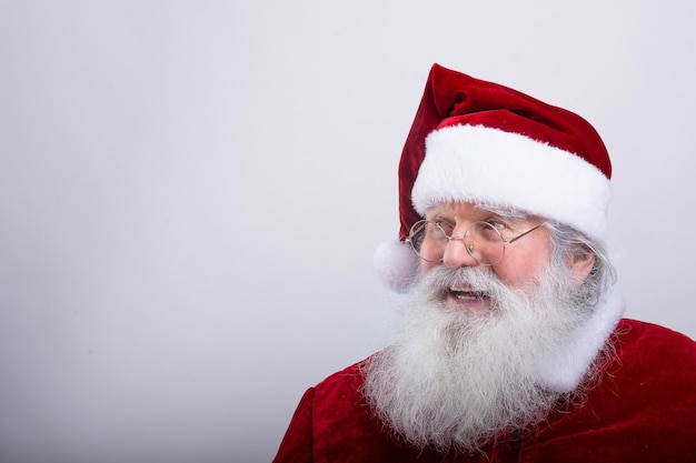 Santa Claus, watching a side  in white wall