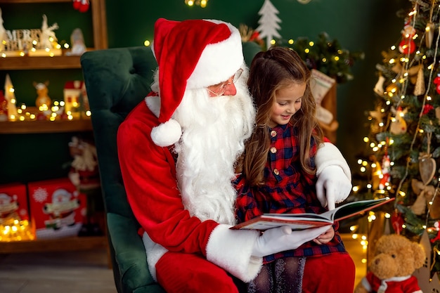 Santa Claus with a little cute girl