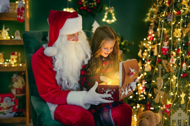 Santa Claus with a little cute girl