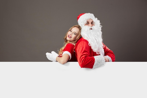 Santa Claus and young beautiful mrs. Claus