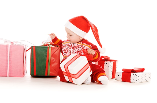 santa helper baby with christmas gifts over white