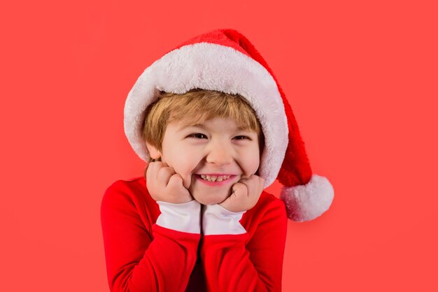 Santa helper elf smiling kid in santa costume santa claus gifts new year christmas kids holiday kid