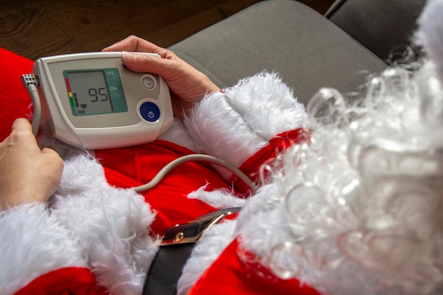 Santa is sick and not feeling well Santa measures blood pressure