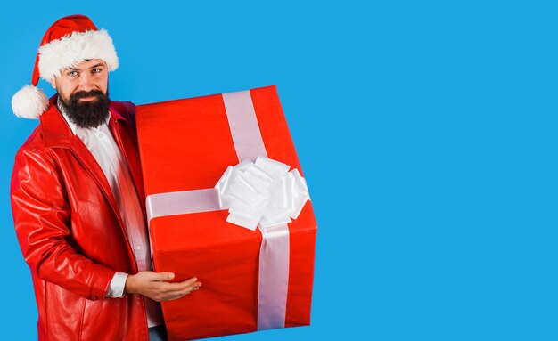 Santa man with christmas gift businessman with new year gift present box copy space for advertising