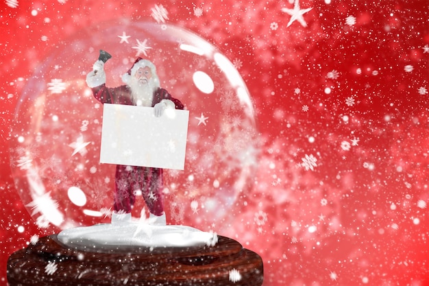 Photo santa ringing bell and holding sign in snow globe against digitally generated delicate snowflake design