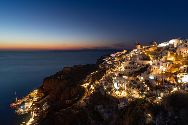 Santorini Oia village in the morning light Amazing sunset view with white houses Island of lovers