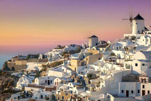 Santorini at Sundown The famous town of Oia in the sunset Romantic holidays Oia Santorini Greece