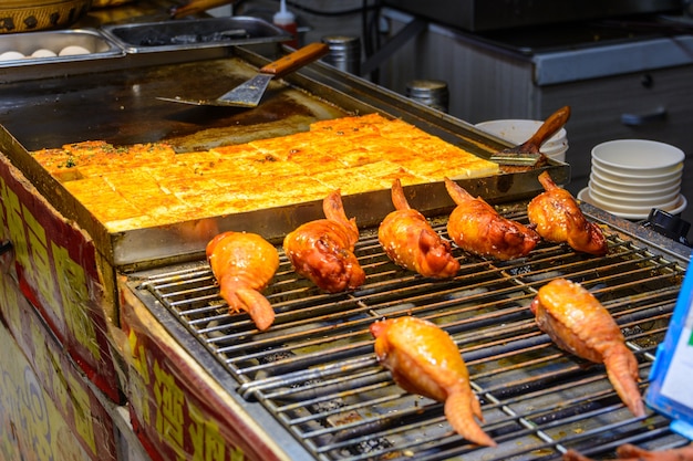 Sanya, Hainan/China - January 7, 2020: Chinese street food. Street trading. Chinese kinds of fresh seafood at an asian seafood market in Sanya, Hainan province, China. Inscription: name food.