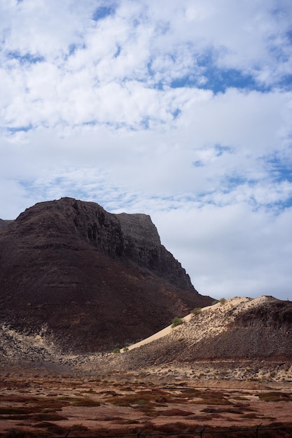 Sao Vicente Cape Verde Surreal mars like landscape with majestic red volcano crater surrounded by sand dune in the distance