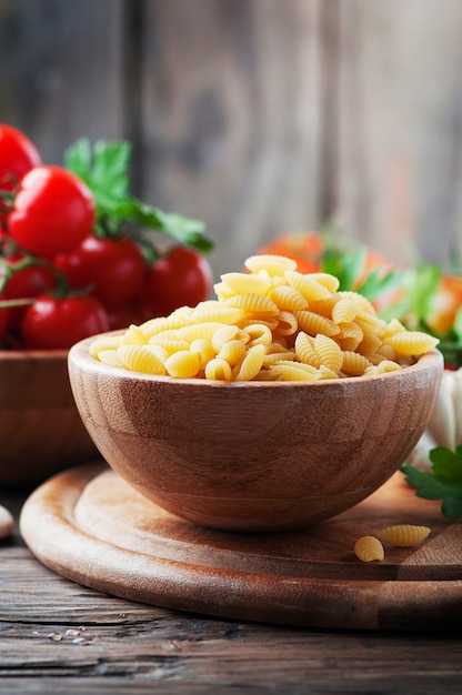 Sardinian uncooked pasta malloreddus on the wooden table