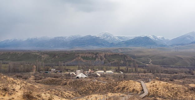 Sarykum dune. Dagestan, Russia. Beautiful mountains near the unique sandy mountain in the Caucasus