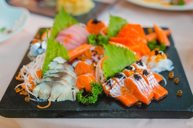 Sashimi Salmon Tuna Hamachi Prawn and Surf Calm set raw fish japanese food in Asian restaurant