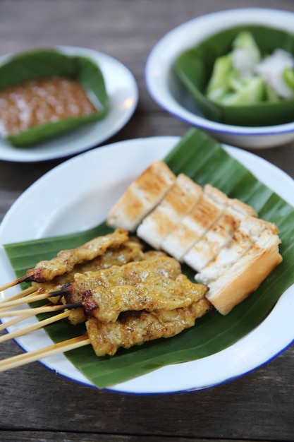 Satay on wood background