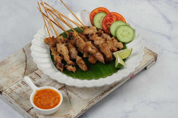 Sate Taichan Grilled Chicken Satay Served on plate with sambal or chilli sauce