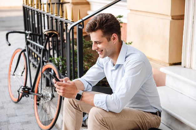 Satisfied young stylish man dressed in shirt