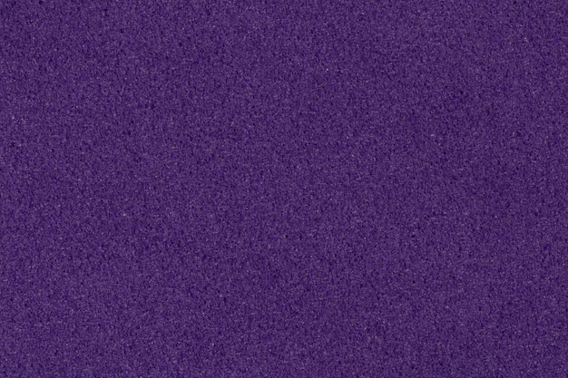 Saturated dark violet foam EVA texture with granular surface