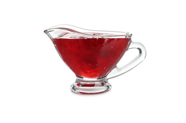 Sauce boat with cranberry sauce isolated on white background