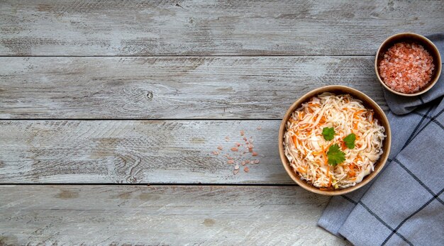 Sauerkraut in a ceramic bowl top view with copy space Fermented food Vegetarianism healthy food