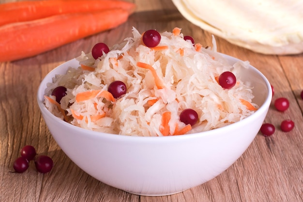 Sauerkraut and ingredients on the kitchen table