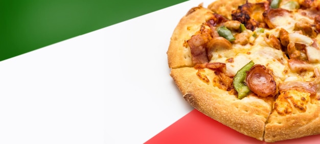 Sausage bacon Cheese pizza on green red color as italy