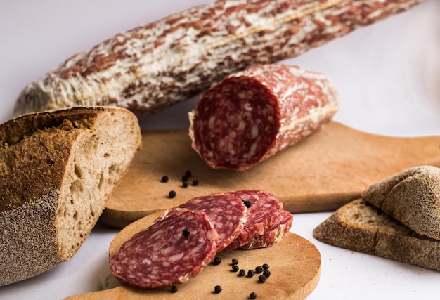 Sausage and bread on white background