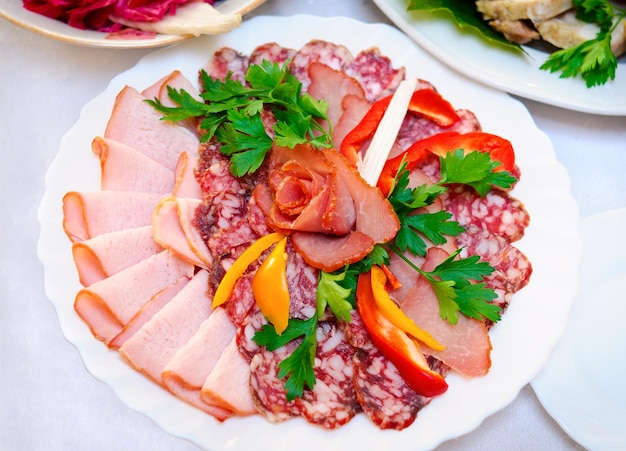 Sausage meat and pepper on a white plate