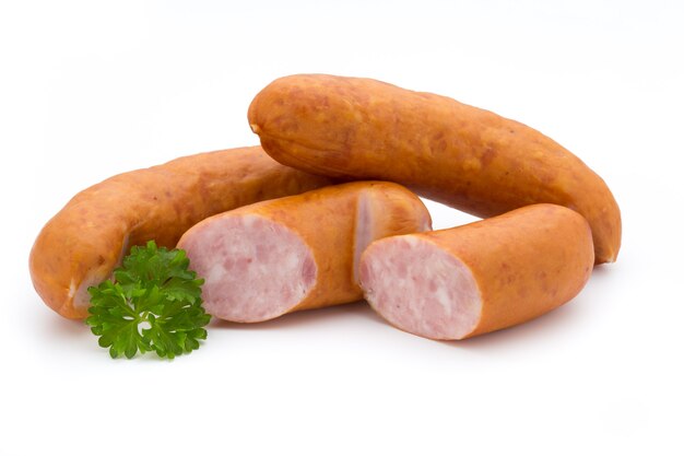 Sausage and spices isolated on white surface, fresh delicious frankfurter.