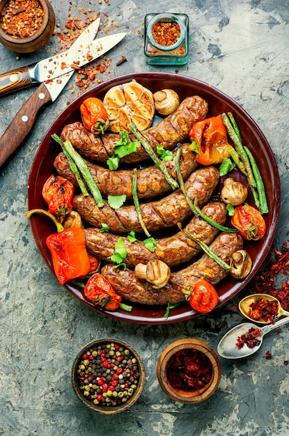 Sausages fried with vegetable