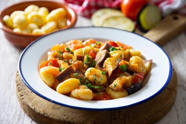 Sauted gnocchi with grilled vegetables. Typical Italian recipe.