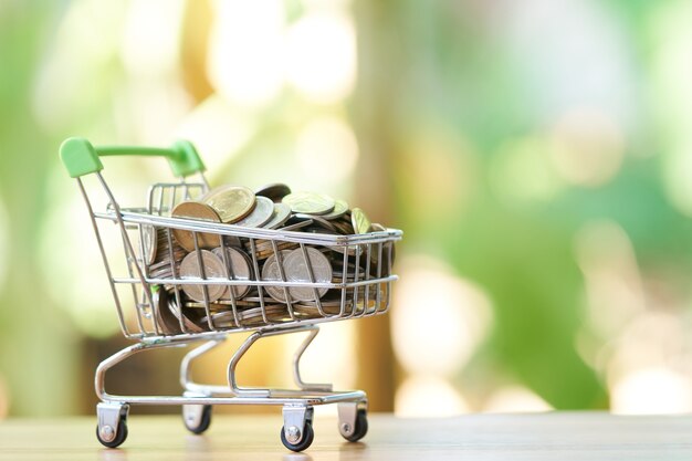 Saving money concept of collecting coins (Thai money) in a Shopping Cart