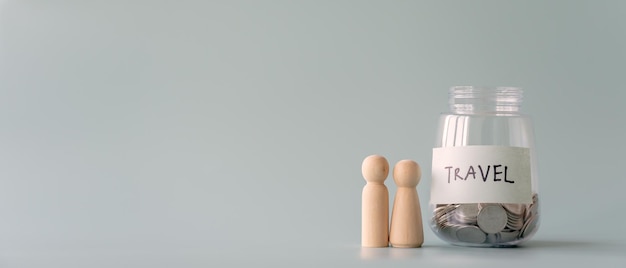 Savings coins jar for travel and human faceless figures beside