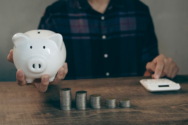 Savings and financial Investments Put a coin in the piggy bank to save money.