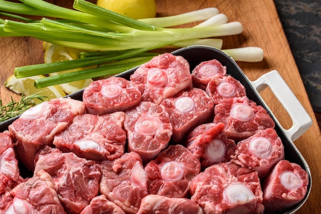 Savory Delicacy CloseUp of Raw Oxtail Pieces Seasoned with Sea Salt and Spices Showcasing in 4k