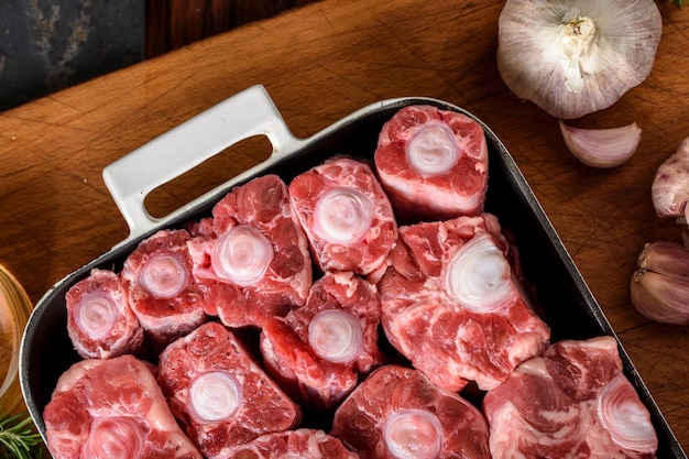 Savory Delicacy CloseUp of Raw Oxtail Pieces Seasoned with Sea Salt and Spices Showcasing in 4k