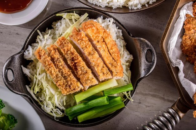 Savory Delights CloseUp of DeepFried Orange Chicken Served on a Bed of Steamed White Rice in 4k