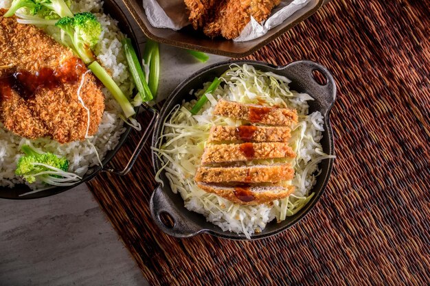 Savory Delights CloseUp of DeepFried Orange Chicken Served on a Bed of Steamed White Rice in 4k