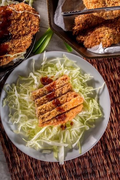 Savory Delights CloseUp of DeepFried Orange Chicken Served on a Bed of Steamed White Rice in 4k