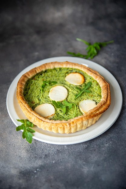 savory pie green spinach tart cheese fresh healthy meal food snack on the table copy space food