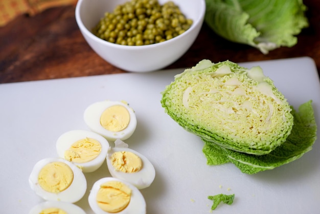 Savoy cabbage salad Cooking Green peas chicken eggs and cabbage Ingredients