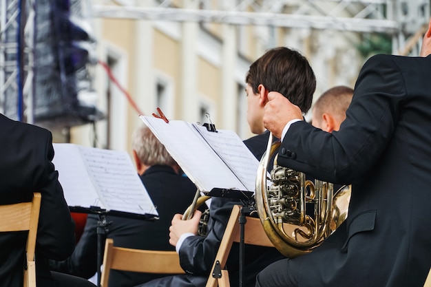 Sax player on a festival outdoors in Ukraine. Cultural performance